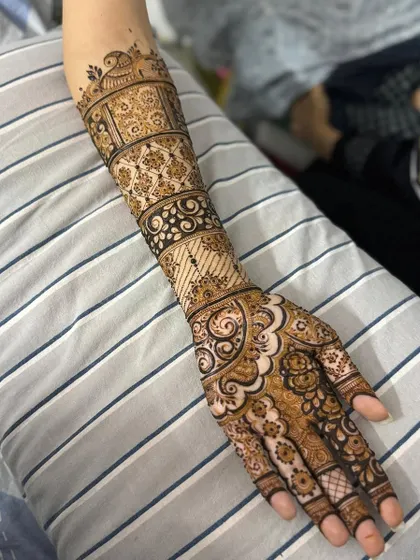 This is a detailed view of my intricate bridal henna work. Each design is unique, combining traditional patterns like paisleys and mandalas with fine-line fillers to create a stunning, full-coverage look for your special day.