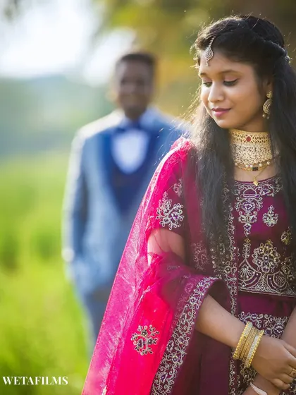 A creative pre-wedding portrait with the groom in the background. This composition adds depth and tells a story of anticipation and love.