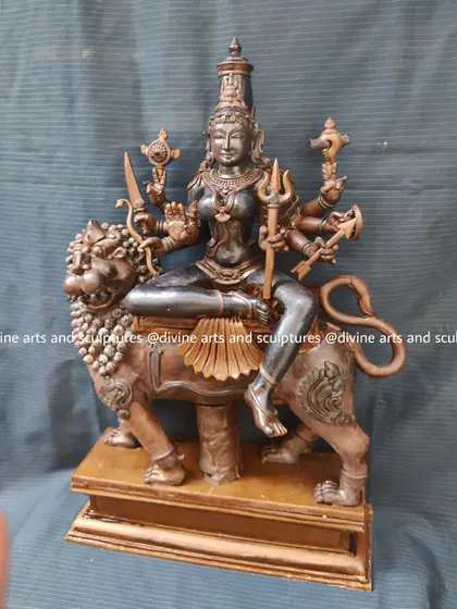The wax model of Goddess Durga seated on her lion mount. This classic representation of the divine feminine power shows her ready for battle, with all her weapons sculpted in detail.