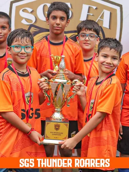 The SGS Thunder Roarers, another one of our Inter-House champion teams, showing off their trophy and medals with pride.