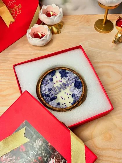 The "Behna" candle beautifully packaged in its red gift box, showcasing how each candle is a special, individual gift.