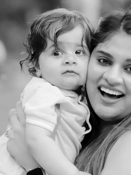 A joyful black and white portrait of a mother and her son, full of laughter and love.