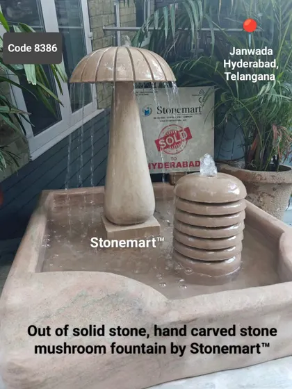 The hand-carved details of the mushroom fountain are evident in this shot. The entire piece is made from solid stone for durability.