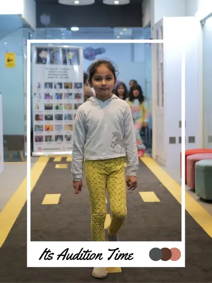 Walking with focus and a smile, this participant is enjoying her audition. We aim to make the experience positive for everyone.
