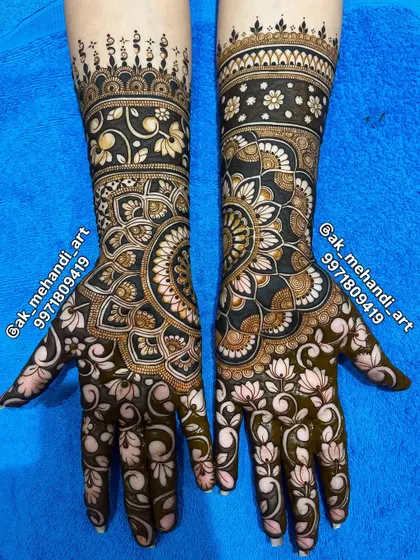 A beautiful engagement mehndi design. The patterns are elaborate, combining mandalas with floral work, creating a stunning look for your ring ceremony.