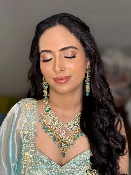A morning Roka bride in a lovely pastel blue outfit. The eye makeup is soft and shimmery, perfect for a daytime event.