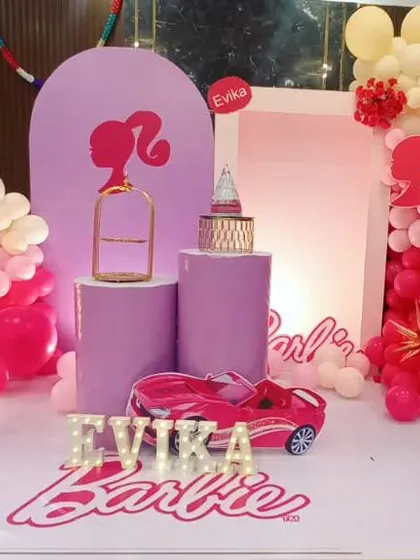 A modern and chic Barbie theme for Evika's 7th birthday. We used shades of pink and lilac, with silhouette props and a toy car for a stylish and playful celebration.