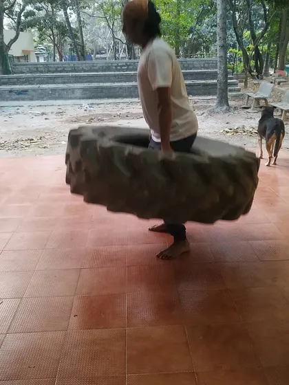 Here I am demonstrating a tire carry. I train alongside my students because a sensei must lead by example.