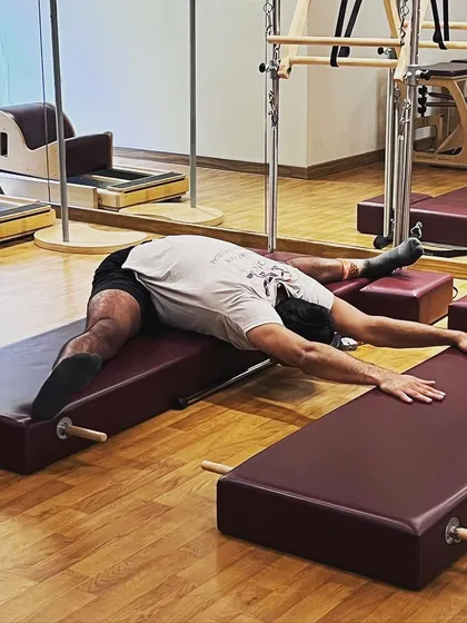 Sometimes a good nap looks like a deep stretch on the Pilates mat. This position helps to open up my hips and release tension, which is just as important as any strength work I do.