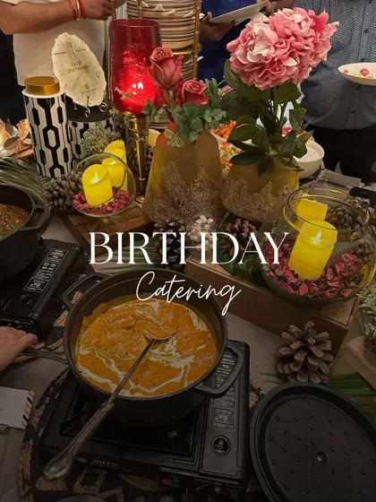 A birthday celebration filled with joy and delicious food. Our buffet setup, decorated with candles and flowers, created a warm and festive ambiance for the special day.