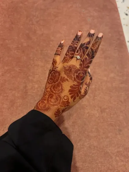This beautiful floral design on the back of the hand shows the rich, mature stain from my standard henna cones. It's a great example of a party or festive design that is both elegant and bold.