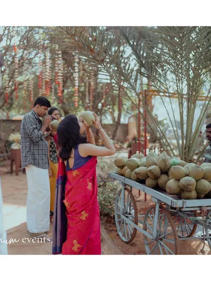 To keep guests refreshed during the summer backyard wedding, we set up a cart with fresh tender coconuts, a simple and thoughtful detail.