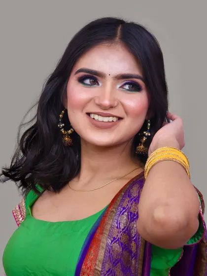 A full look with the colorful saree, showing how the makeup and outfit come together perfectly.