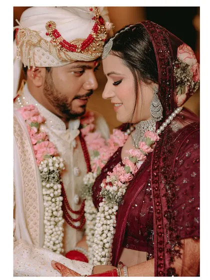 A close, intimate portrait of the wedding couple, capturing the loving and gentle expression they share.
