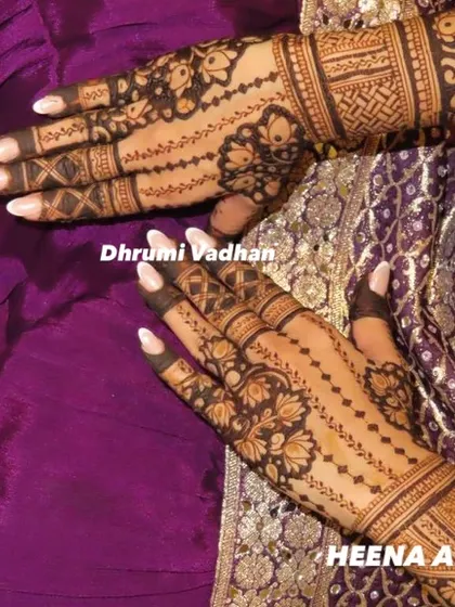 A beautiful example of teamwork. This intricate design was created for a member of the bridal party, featuring delicate floral and geometric patterns.