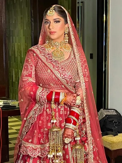 A simple and elegant braid for this beautiful morning bride. The style is perfect for an early ceremony and looks stunning with her red lehenga.