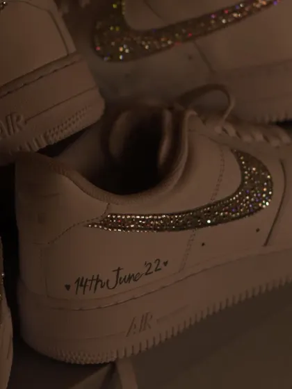 A close-up of the iced-out swoosh. Each crystal is applied by hand to create this sparkling effect. It's a great way to add a touch of glamour to a classic sneaker.