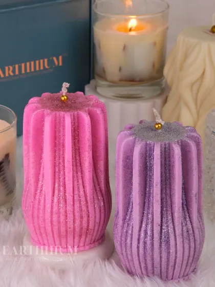 These ribbed pillar candles in pink and purple have a lovely glitter finish. Their modern shape and vibrant colors make them a fun and stylish addition to any space.