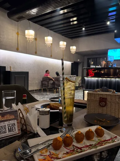 Showcasing the indoor seating and food at Limitless, giving a complete picture of what to expect.