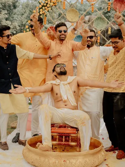 The groom and his squad, ready for the Haldi. This fun group shot captures the excitement and camaraderie of the groom's side before the festivities kick off.