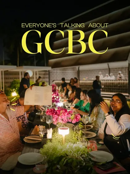 Everyone's talking about GCBC. A large group celebrating together at a long table on our lawn.