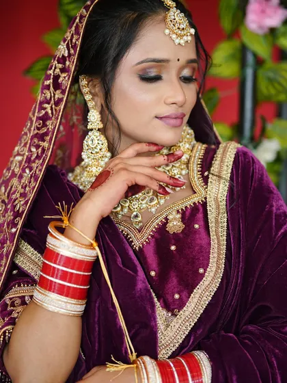This shot captures the elegance of the bride, showing how the makeup, jewelry, and outfit come together.