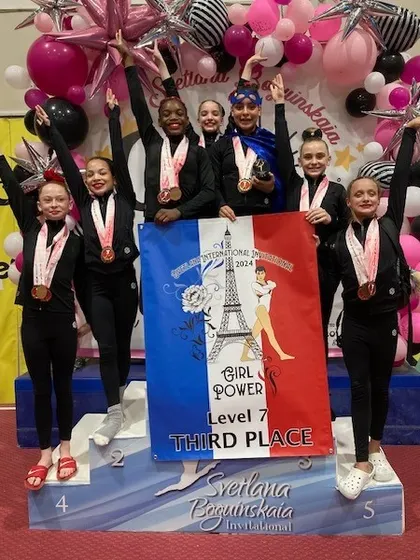 The Level 7 team celebrates their 3rd place finish at the Svetlana Invitational.