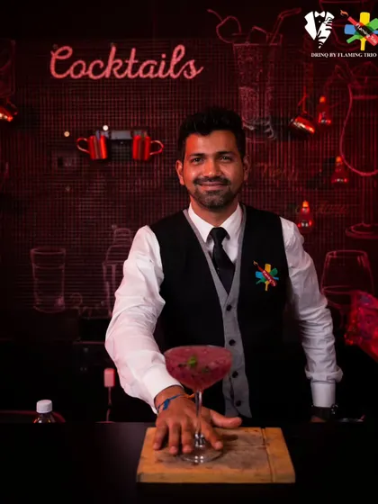 Our mixologist presents a vibrant dragon fruit cocktail. This image showcases our ability to work with exotic ingredients to create beautiful and delicious custom drinks.