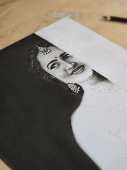A progress shot showing the face and jewelry details.