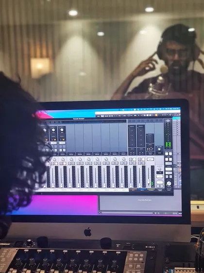 A view from the control room into the live room during a recording session. Our setup allows for clear communication and a seamless workflow.