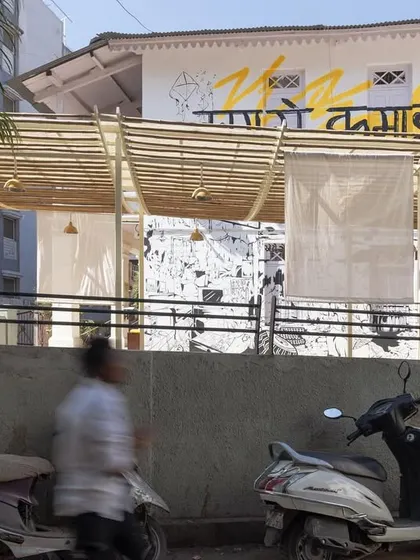 The plaza viewed from the street, showing how it plugs into the dense urban fabric of Mirzapur. The design is a sensitive response to the adjacent heritage buildings and the active street life.
