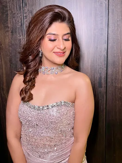 A close-up of the Diwali party glam. The eyes have a beautiful wash of pink and shimmer, while the skin is kept dewy and fresh.