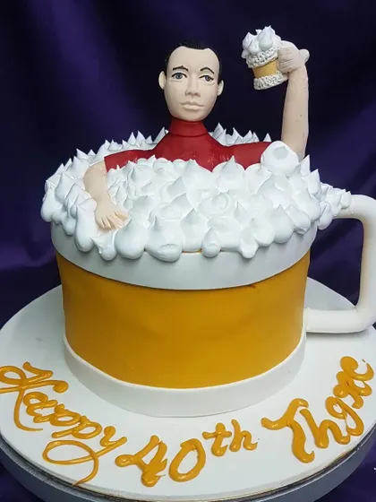 A cake for the beer lover. This beer mug cake, complete with a custom caricature and frothy buttercream foam, is a fun and personal way to celebrate a 40th birthday or any special occasion.