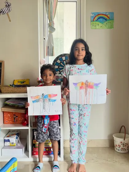 Aman and Zahra proudly present their watercolor dragonfly paintings. This drip-effect technique is so much fun and creates such a dynamic look.