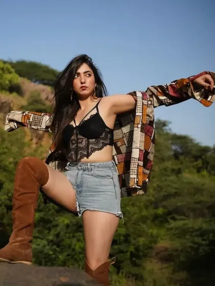 Fearless and fabulous. A dynamic pose in my shorts and boots outfit, capturing a sense of freedom and power.