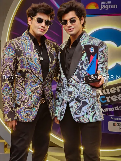 A closer look at the Sobo Guys' printed jackets. The satin lapels provide a classic anchor to the vibrant, peppy prints, creating a look that is both fun and sophisticated.