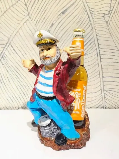 A sailor-themed bottle holder in a different pose. These unique pieces are always a hit at parties.