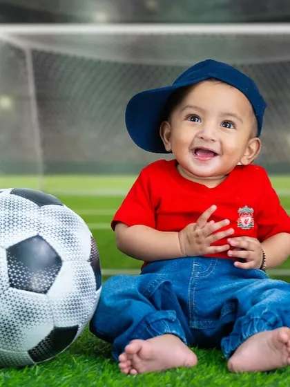 A close-up of our happy little footballer. I can customize these sports themes to feature your family's favorite team.