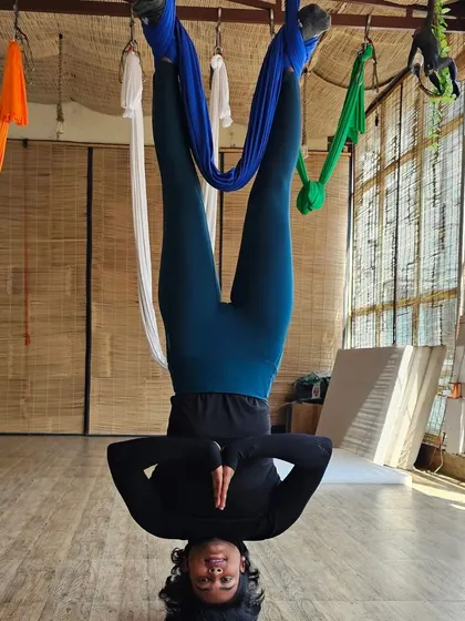 An inverted prayer pose, which is a fantastic way to build shoulder stability and core control. The view from my training in Rishikesh wasn't bad either.
