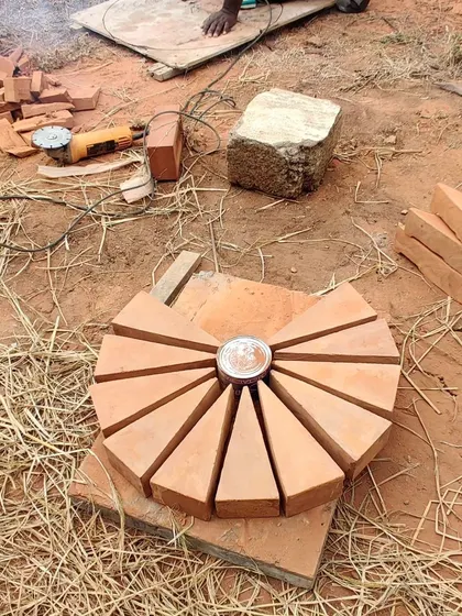 Another view of the custom-cut bricks, ready to be placed at the center of the dome structure.