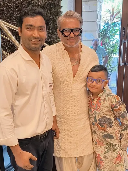 Aalim Hakim posing with our staff and a young fan. We love creating happy moments for our guests.