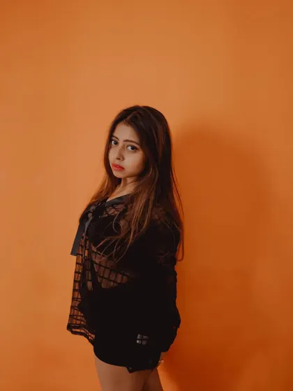 A simple yet striking portrait against a solid color background. This technique makes the subject the undeniable focus of the image.