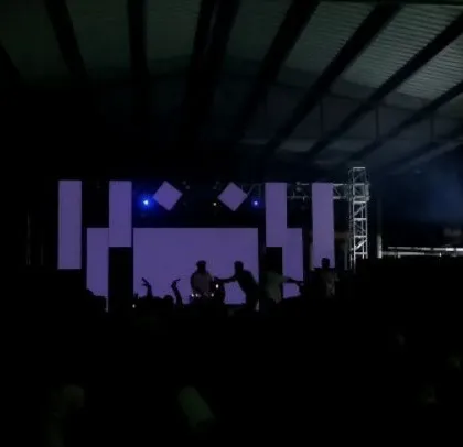 A darker, moodier shot of the stage and LED screen.
