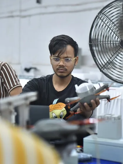 Behind every show is our team of visionary engineers. On Engineer's Day, we celebrate our innovators, like this team member inspecting a drone, whose passion and precision light up the world.