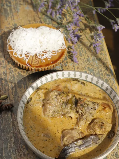 Creamy Nasrani chicken stew paired with delicate, stringy Idiyappam. The light, lacy texture of the idiyappam is perfect for soaking up the fragrant, coconut-milk-based gravy.