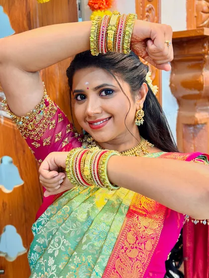 A playful pose from Swetha Khelge, also giving a good view of the matching bangles.