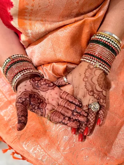 Another angle of the beautiful Karwachauth stain, showing how the design looks with traditional bangles.