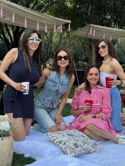 A group of friends posing at the chic picnic party. Our setups are designed to be the perfect backdrop for all your Instagrammable moments.