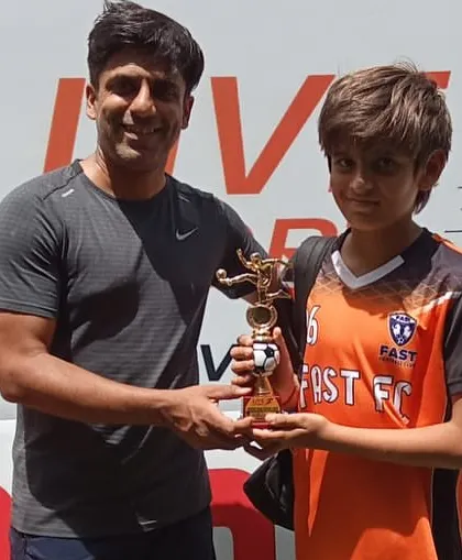 One of our U11 players receiving his runners-up trophy after a great performance in the Junior Cup.