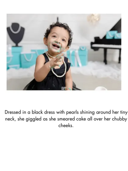 A close-up of the birthday girl with cake on her face and a huge smile, the perfect cake smash moment.